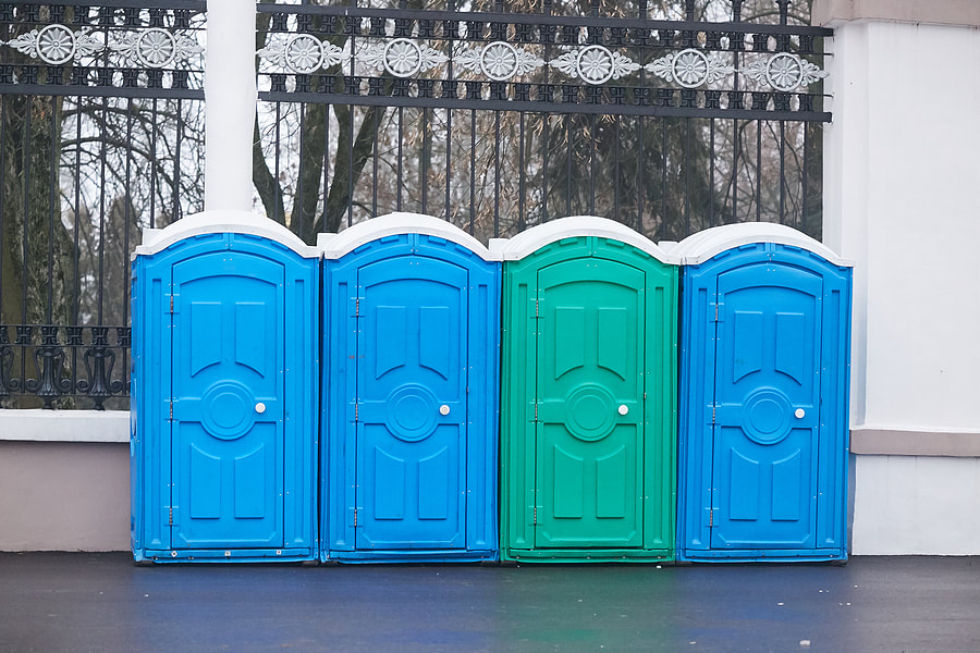 newly painted toilets beside the wall